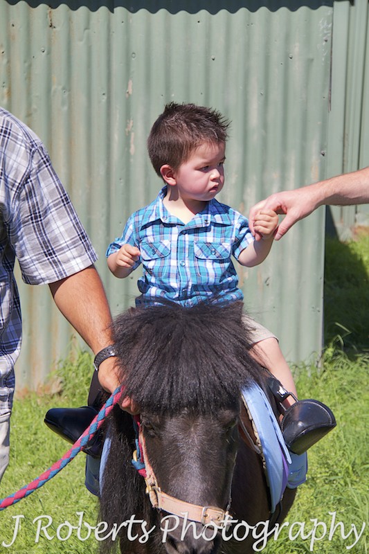 boy riding pony at birthday party - Party Photography Sydney